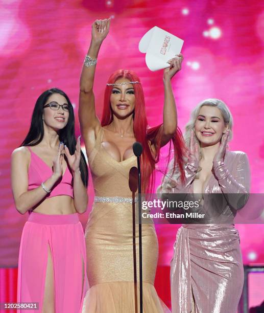 Adult film actresses Alex Coal, Nicolette Shea and Violet Doll present an award during the 2020 Adult Video News Awards at The Joint inside the Hard...