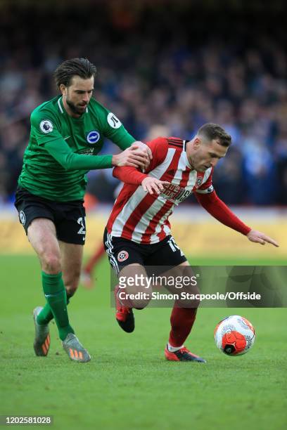 Davy Propper of Brighton battles with Billy Sharp of Sheff Utd during the Premier League match between Sheffield United and Brighton & Hove Albion at...