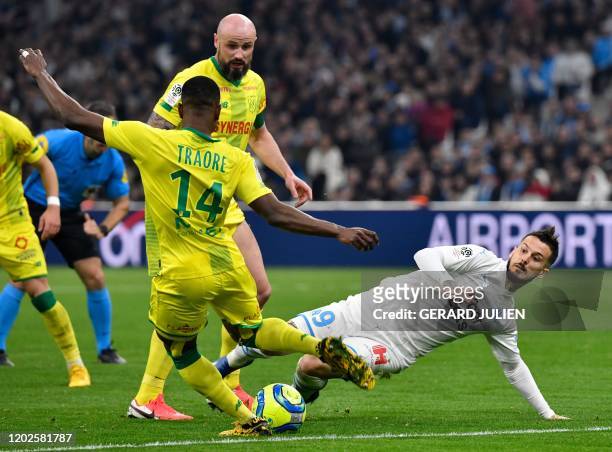 Nantes' Malian defender Charles Traore vies with Marseille's Argentine forward Dario Benedetto during the French L1 football match between Olympique...