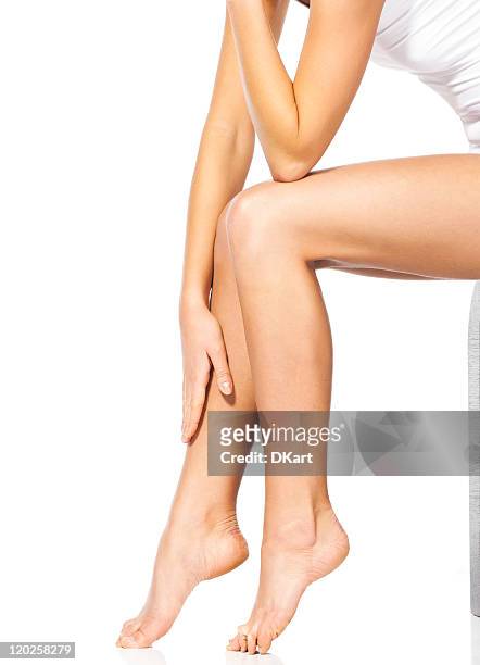 thin and long feet of the beautiful sitting woman - female knee pain stockfoto's en -beelden