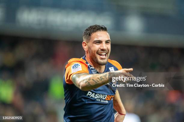 January 25: Andy Delort of Montpellier celebrates after scoring his sides second goal as he points to team mate Florent Mollet of Montpellier who...