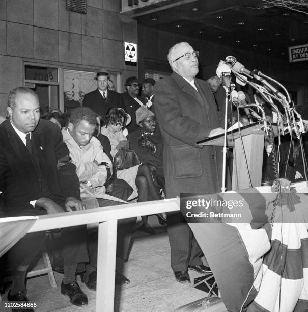Bishop Alvin Childs leads 10,000 civil rights demonstrators in a prayer during a rally at the Hotel Theresa in Harlem. The demonstrators marched...