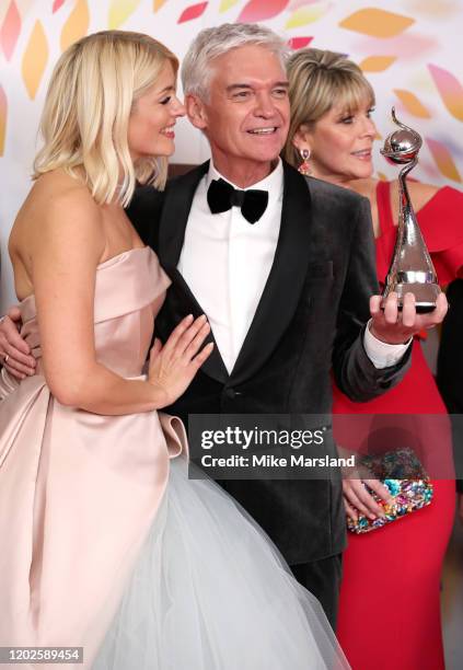 Holly Willoughby and Phillip Schofield pose with the award for Live Magazine Show for 'This Morning' in the winners room attends the National...