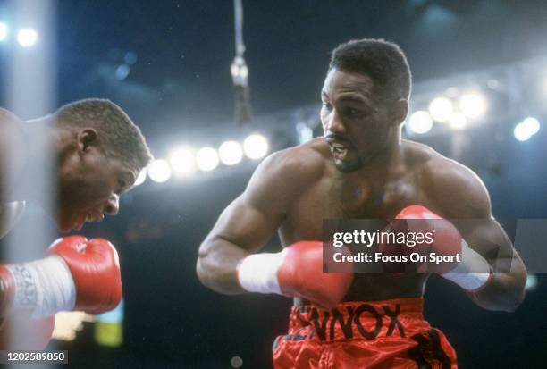 Lennox Lewis and Tyrell Biggs fight in a heavyweight match on November 23, 1991 at the Omni Coliseum in Atlanta, Georgia. Lewis won the fight with a...