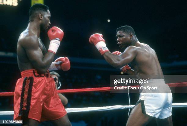 Lennox Lewis and Tyrell Biggs fight in a heavyweight match on November 23, 1991 at the Omni Coliseum in Atlanta, Georgia. Lewis won the fight with a...