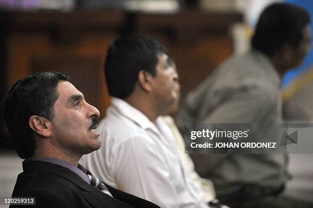 Carlos Antonio Carias Lopez gestures before being sentenced to 6,066 years in prision on August 02, 2011 in Guatemala City. For military murder of...