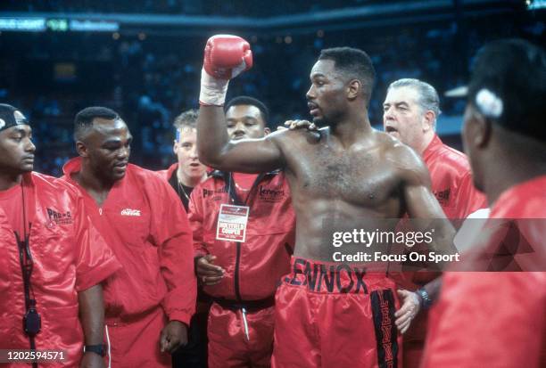 Lennox Lewis celebrates after he defeated Tyrell Biggs in a heavyweight match on November 23, 1991 at the Omni Coliseum in Atlanta, Georgia. Lewis...