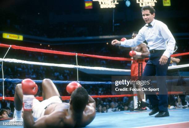Tyrell Biggs lays on his back after he was knocked down by Lennox Lewis in a heavyweight match on November 23, 1991 at the Omni Coliseum in Atlanta,...