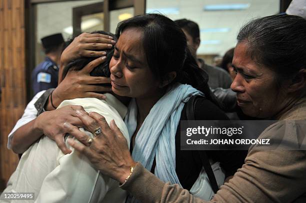 Reyes Collin Gualip is embraced by relatives before being sentenced to 6,060 years in prison on August 02, 2011 in Guatemala City. Four military...