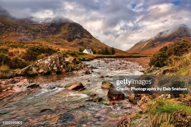 cottage along river coupall in glencoe scotland - grampian scotland stock pictures, royalty-free photos & images