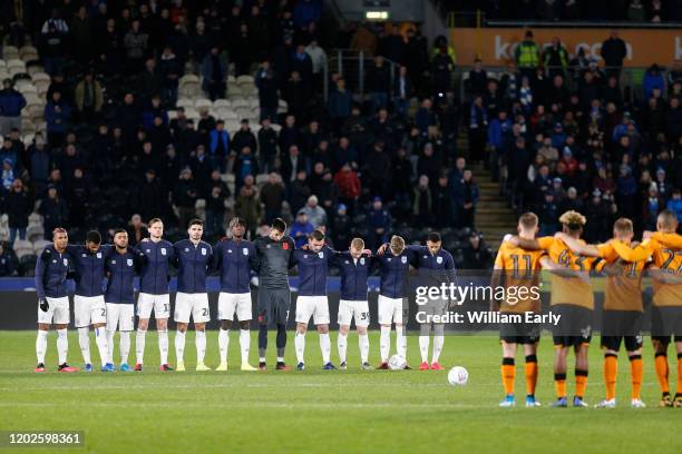 Players of Huddersfield Town and Hull City pay their respects to Jordan Sinnott during the Sky Bet Championship match between Hull City and...