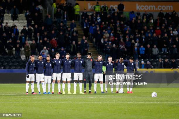 Players of Huddersfield Town and Hull City pay their respects to Jordan Sinnott during the Sky Bet Championship match between Hull City and...