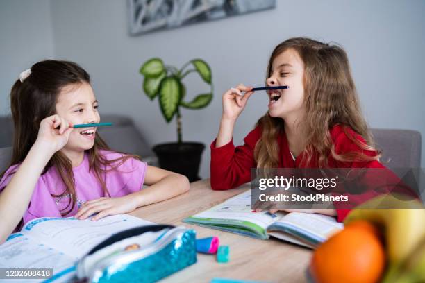 Twins Doing Math Twin Sisters Studying Together Photos and Premium High Res Pictures ...