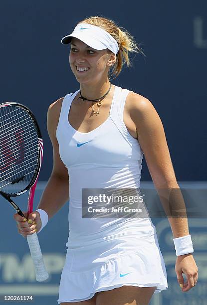 Sabine Lisicki of Germany smiles following her victory over Greta Arn of Hungary during the Mercury Insurance Open presented by Tri-City Medical at...