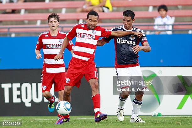Maykel Galindo of the FC Dallas defends the ball from Paulo Nagamura of the Chivas USA at Pizza Hut Park on July 31, 2011 in Frisco, Texas.