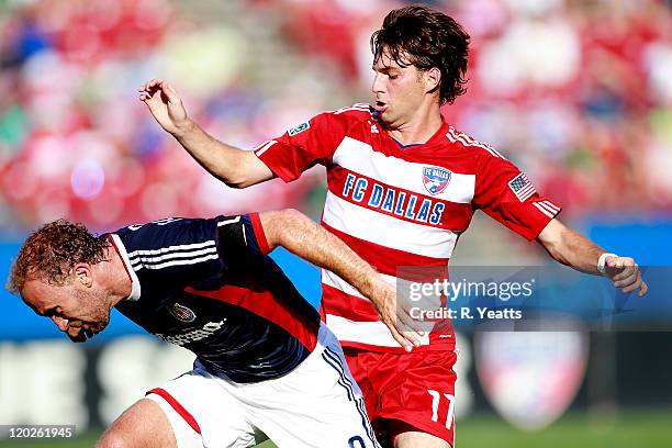 Simon Elliott of the Chivas USA challenges Ricardo Villar of the FC Dallas at Pizza Hut Park on July 31, 2011 in Frisco, Texas.