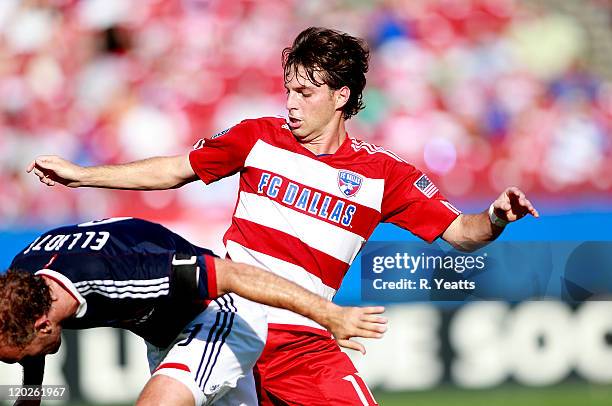 Simon Elliott of the Chivas USA challenges Ricardo Villar of the FC Dallas at Pizza Hut Park on July 31, 2011 in Frisco, Texas.