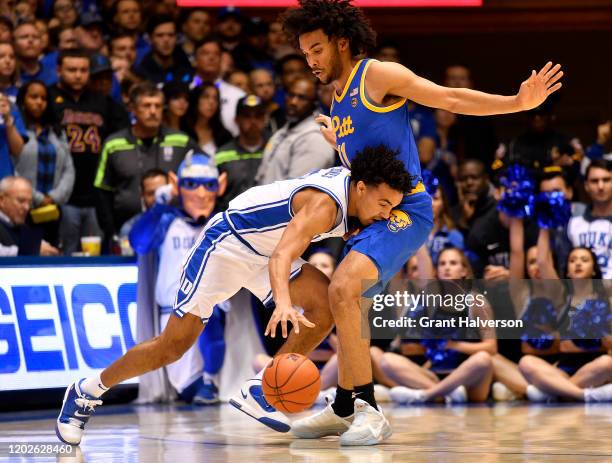 Justin Champagnie of the Pittsburgh Panthers defends Tre Jones of the Duke Blue Devils during the first half of their game at Cameron Indoor Stadium...