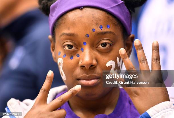 Duke Blue Devils fan wearing purple and gold honors former NBA great Kobe Bryant during a game against the Pittsburgh Panthers at Cameron Indoor...