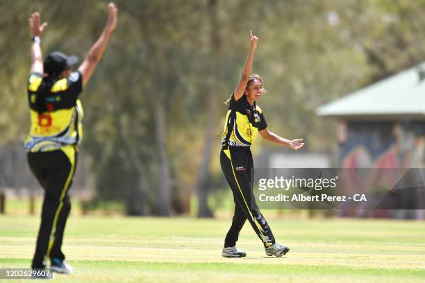 Rikki Garlett of Western Australia celebrates dismissing Bianca Clarke of the Northern Territory in the women's match between the Northern Territory...