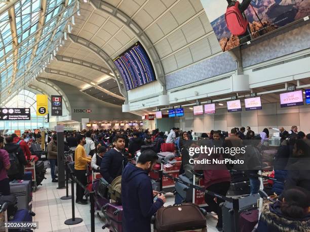 Crowd of passengers waiting to check-in for their flight at Pearson International Airport in Ontario, Canada. Pearson International Airport is...