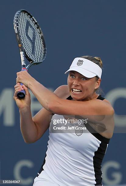 Vera Zvonareva of Russia follows through on a backhand return to Jill Craybas during the Mercury Insurance Open presented by Tri-City Medical at the...