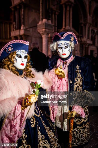 People wearing Carnival costume poses near the Saint Mark's on February 22, 2020 in Venice, Italy. The theme for the 2020 edition of Venice Carnival...