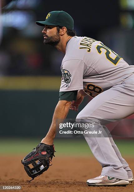 First baseman Conor Jackson of the Oakland Athletics watches the pitch during the game against the Seattle Mariners at Safeco Field on August 1, 2011...