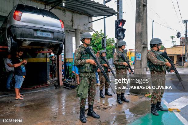Brazilian Armed Forces soldiers stand guard in the streets of Fortaleza, Ceara state, Brazil, on February 22, 2020. - 51 homicides were registered in...