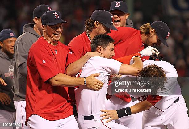 Jacoby Ellsbury of the Boston Red Sox knocks in the winning run and celebrates against the Cleveland Indians at Fenway Park on August 2, 2011 in...