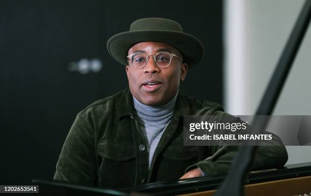 British pianist and composer Alexis Ffrench poses for a photograph after giving an interview at Steinway & Sons in London on February 19, 2020....