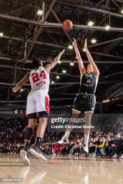 February 22: Henry Ellenson of the Mississauga Raptors 905 shoots the ball over a defending Yante Maten of the Maine Red Claws at the Paramount Fine...