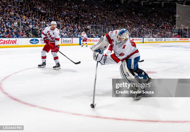 Dave Ayres of the Caroline Hurricanes plays the puck against the Toronto Maple Leafs during the second period at the Scotiabank Arena on February 22,...