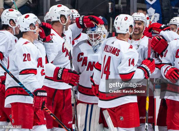 Emergency backup goaltender Dave Ayres of the Carolina Hurricanes celebrates with teammates after defeating the Toronto Maple Leafs at the Scotiabank...