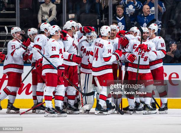 Emergency backup goaltender Dave Ayres of the Carolina Hurricanes celebrates with teammates after defeating the Toronto Maple Leafs at the Scotiabank...