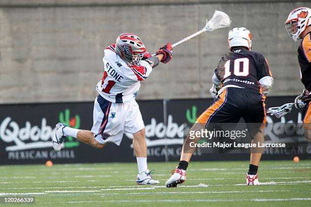 Mike Stone of the Boston Cannons lets a shot fly against Kyle Rubisch and the Toronto Nationals on July 24, 2010 at Harvard Stadium in Boston,...