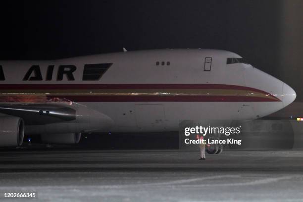 Boeing 747-4B5, on a charter flight from Wuhan, China, arrives at Ted Stevens Anchorage International Airport on January 28, 2020 in Anchorage,...