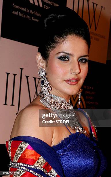 Indian Bollywood actress Zarine Khan poses on the catwalk during the second edition of The Indian International Jewellery Week 2011 in Mumbai late...