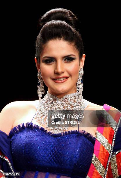 Indian Bollywood actress Zarine Khan poses on the catwalk during the second edition of The Indian International Jewellery Week 2011 in Mumbai late...