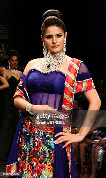 Indian Bollywood actress Zarine Khan poses on the catwalk during the second edition of The Indian International Jewellery Week 2011 in Mumbai late...