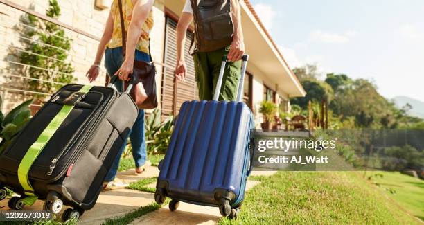 can't wait to see the room - suitcase couple stock pictures, royalty-free photos & images