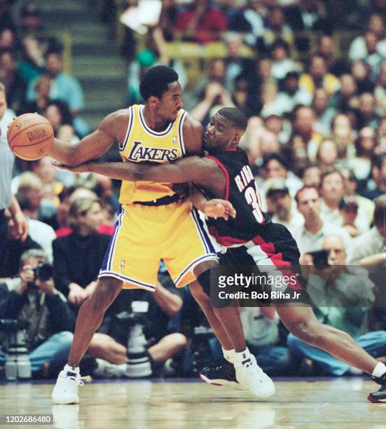 Los Angeles Lakers Kobe Bryant battles Isaiah Rider during Game 1 action during the NBA Playoff game against Portland Trailblazers in Los Angeles,...