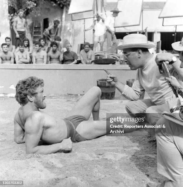 American actor Kirk Douglas , as Ulysses, being directed by Italian director Mario Camerini on the set of the film Ulysses. 1953