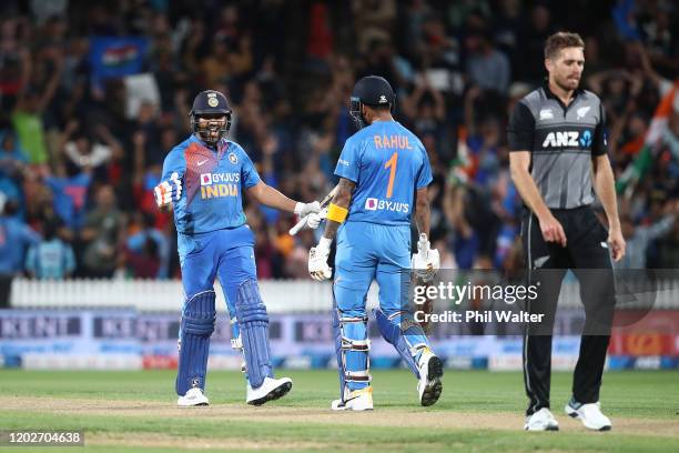 Rohit Sharma of India celebrates hitting the winning 6 on the last ball of the super over with KL Rahul during game three of the Twenty20 series...