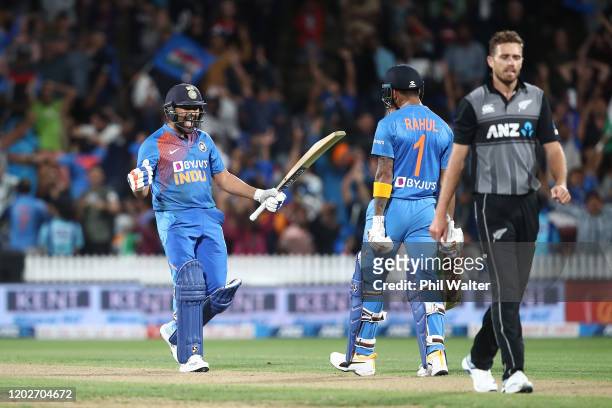 Rohit Sharma of India celebrates hitting the winning 6 on the last ball of the super over with KL Rahul during game three of the Twenty20 series...