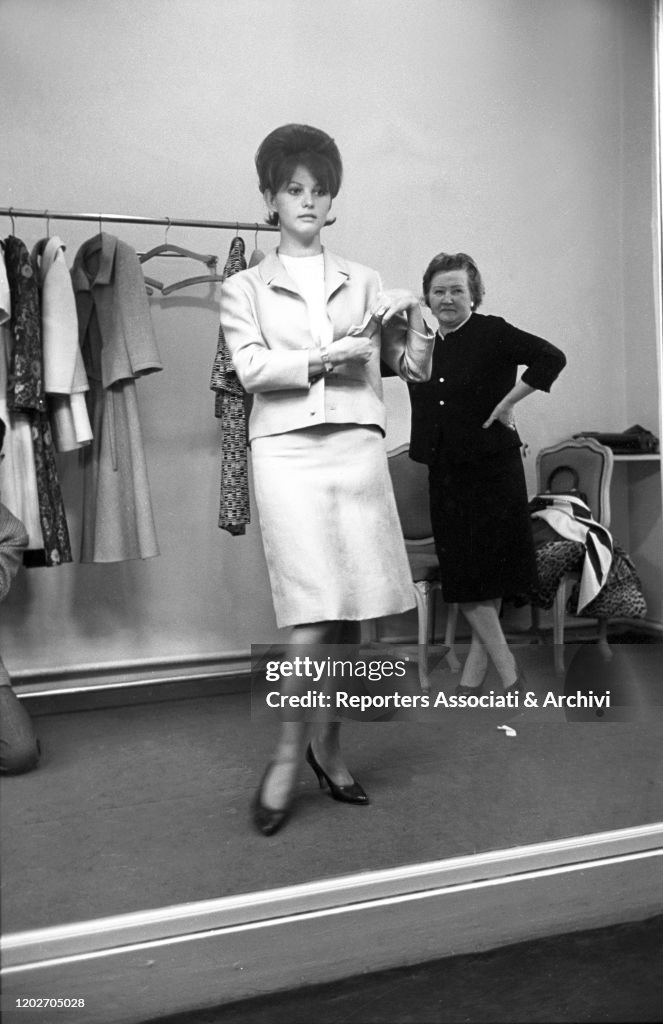 Claudia Ricci Italian actress Claudia Cardinale trying on a dress at Nina Ricci's ...