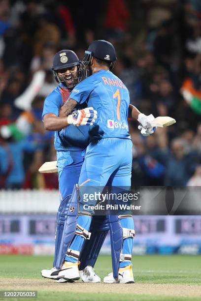 Rohit Sharma of India celebrates hitting the winning 6 on the last ball of the super over with KL Rahul during game three of the Twenty20 series...