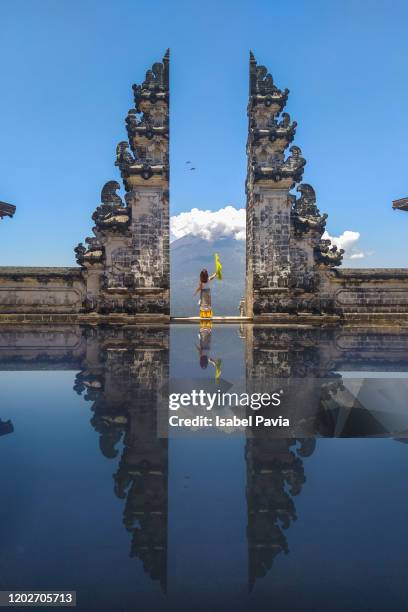 woman standing at gate to heaven of pura lempuyang temple, bali, indonesia - city gate bildbanksfoton och bilder