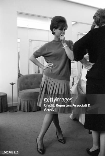 Italian actress Claudia Cardinale at Nina Ricci's fashion house in Paris. Paris, 10th February 1962