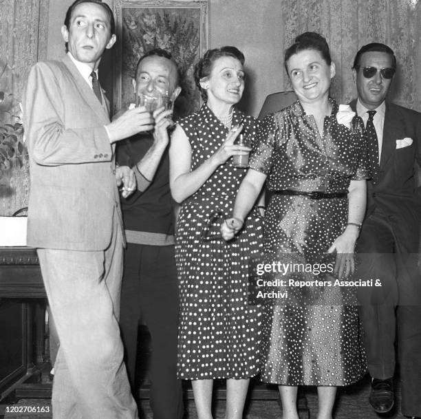 Italian fashion designers Emilio Schuberth and Giovanna and Zoe Fontana smiling at the cocktail party held by the Sindacato Italiano Alta Moda at the...